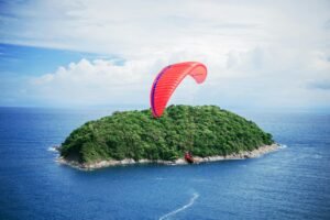 Person Riding Parachute
